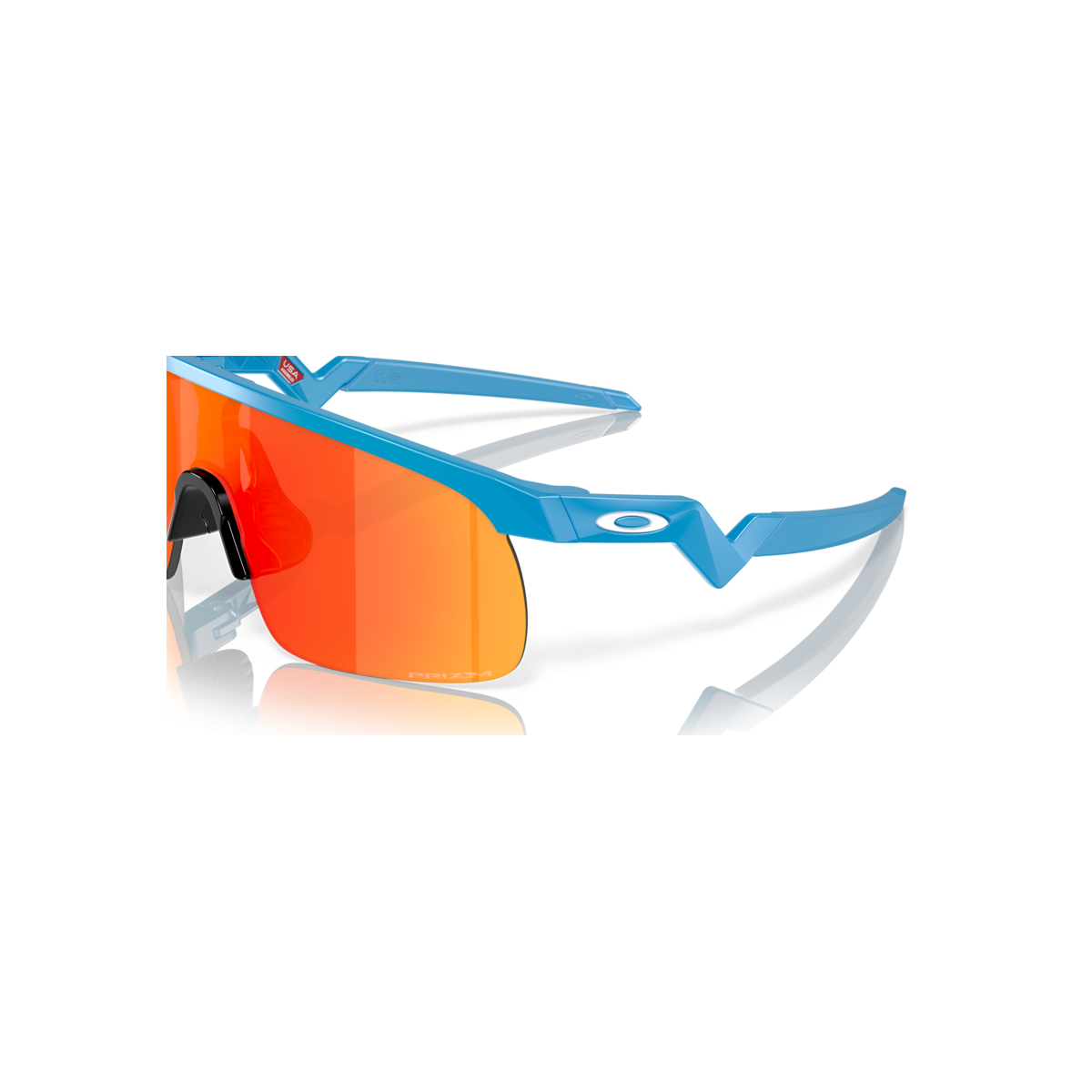 detalle del cristal de Gafas de sol para bicicleta Oakley Resistor para niños y niñas azul cielo Prizm Ruby 922904