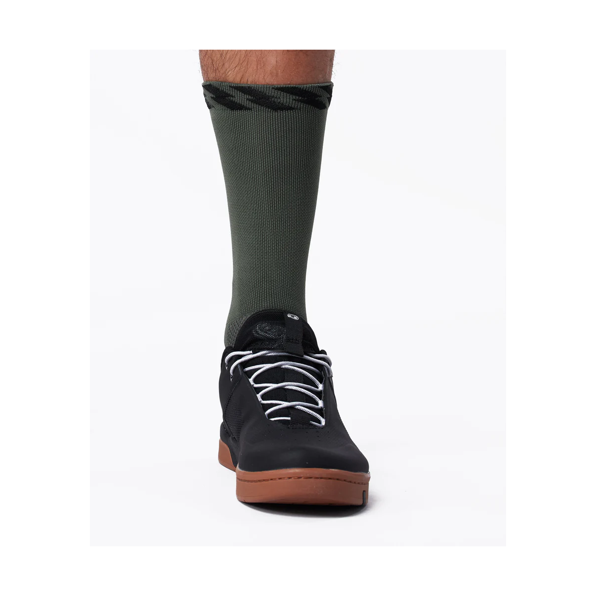 Calcetines MTB de bicicleta Muc-Off técnicos color verde en zapatilla